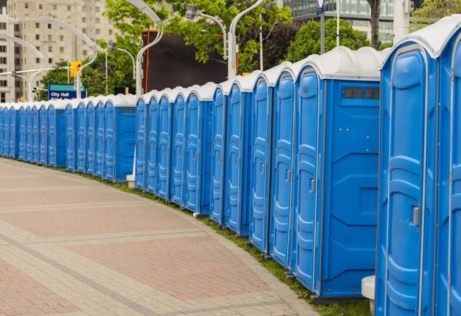 a row of portable restrooms set up for a large athletic event, allowing participants and spectators to easily take care of their needs in Allen Park, MI